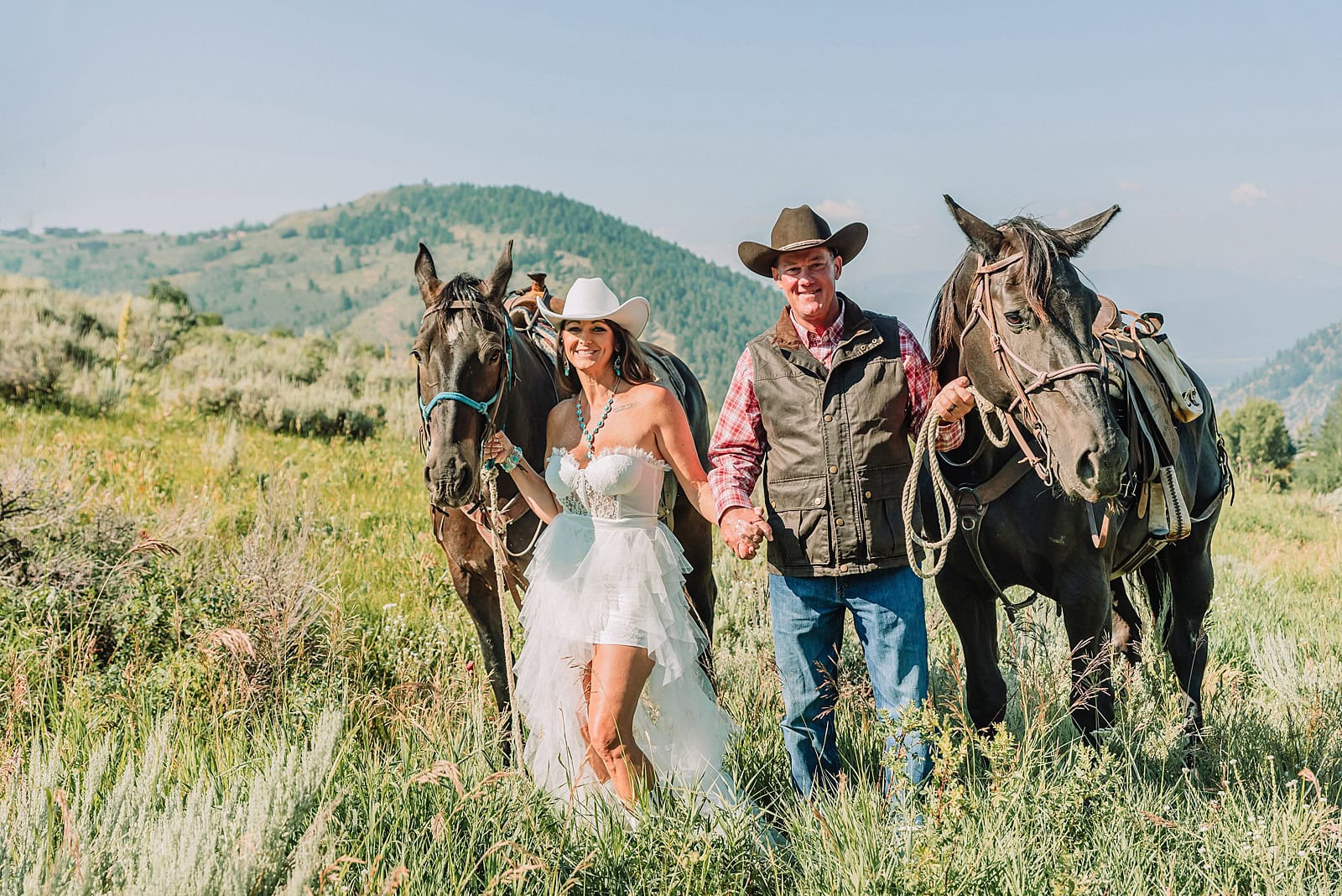 jackson hole elopement at spring creek ranch summer elopement in Grand Teton National Park summer wedding in Jackson Hole Grand Teton National Park wedding Jackson Hole summer wedding summer wedding in Wyoming Romantic summer elopement in the Tetons Western-themed elopement in Wyoming Adventure elopements in Jackson Hole Romantic horseback elopement in the Tetons Horseback riding elopement in Jackson Hole spring creek ranch horseback riding elopement