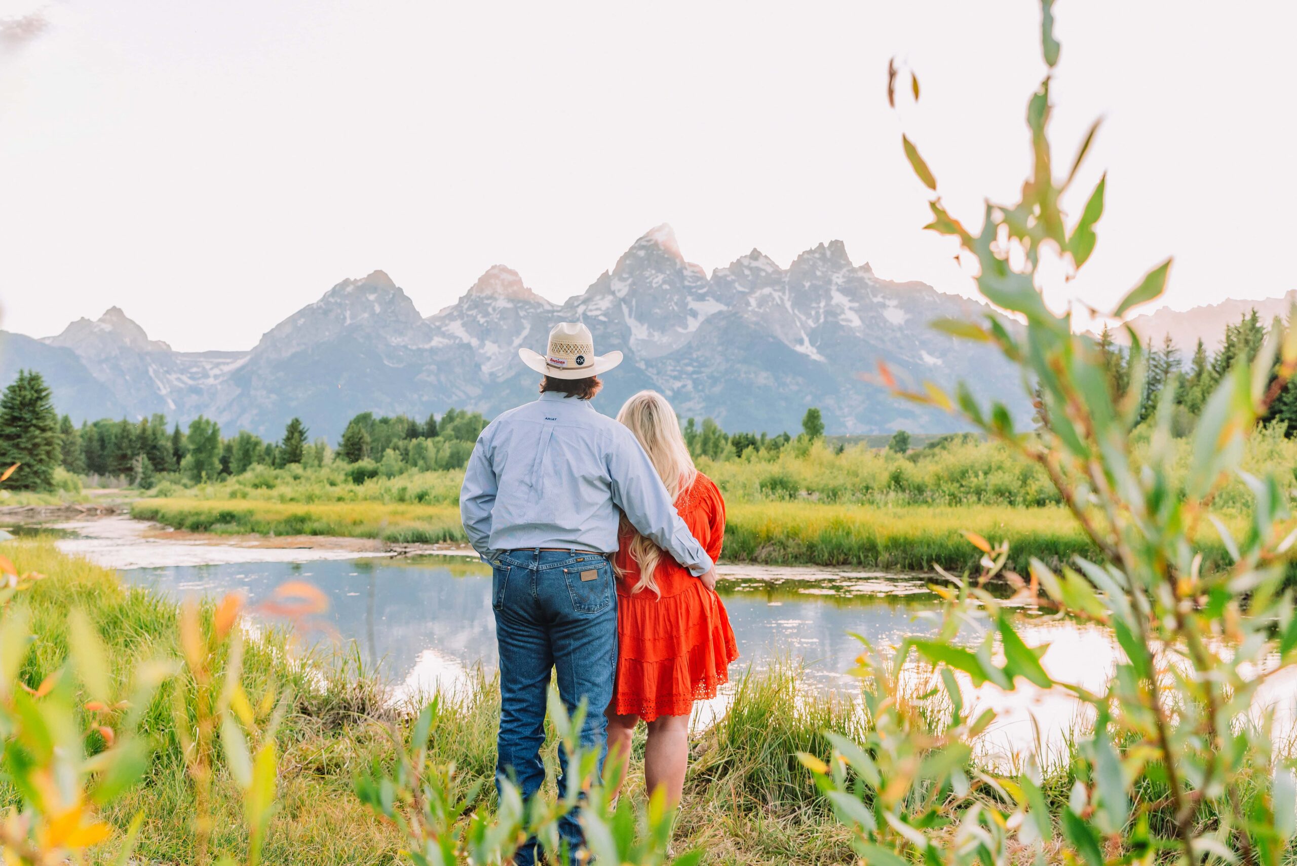 jackson hole photography schwabacher landing couple portraits in jackson hole colorful and vibrant photography engagement photo ideas