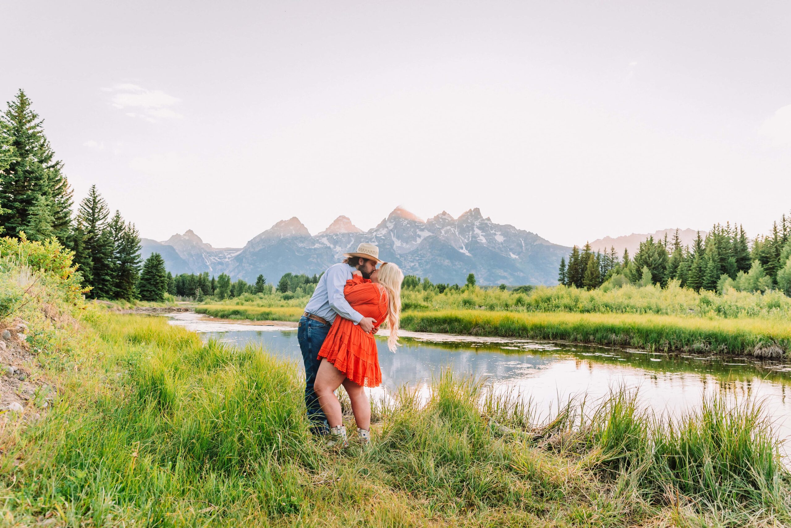 jackson hole photography schwabacher landing couple portraits in jackson hole colorful and vibrant photography engagement photo ideas