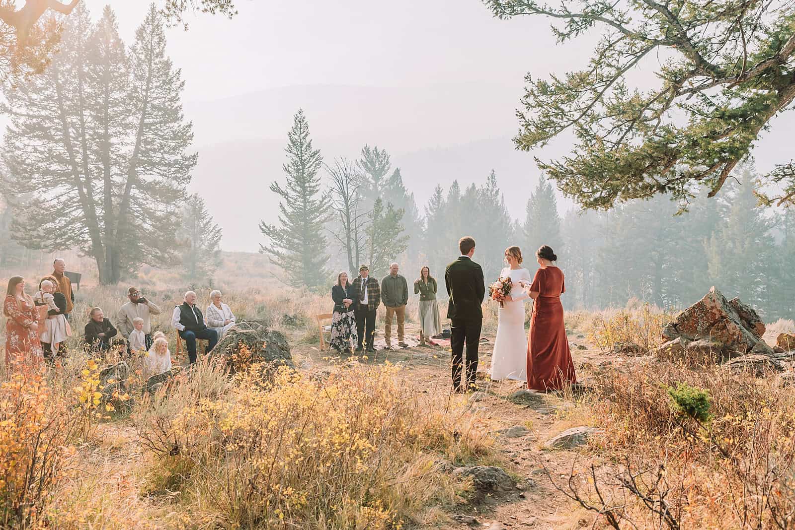 eloping in jackson hole wyoming wyoming elopement photographer micro wedding jackson hole jackson hole wedding photographers elopement jackson hole wyoming small wedding jackson hole the wedding tree in bridger teton national forest morning wedding fall wedding Autumn wedding in Jackson Hole Weather-Proofing Your Jackson Hole Wedding