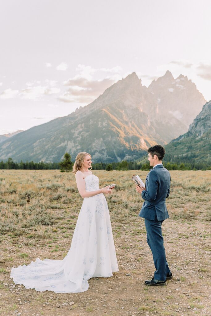 bride and groom share vows while wedding officiant performs ceremony at Cathedral Group Turnout