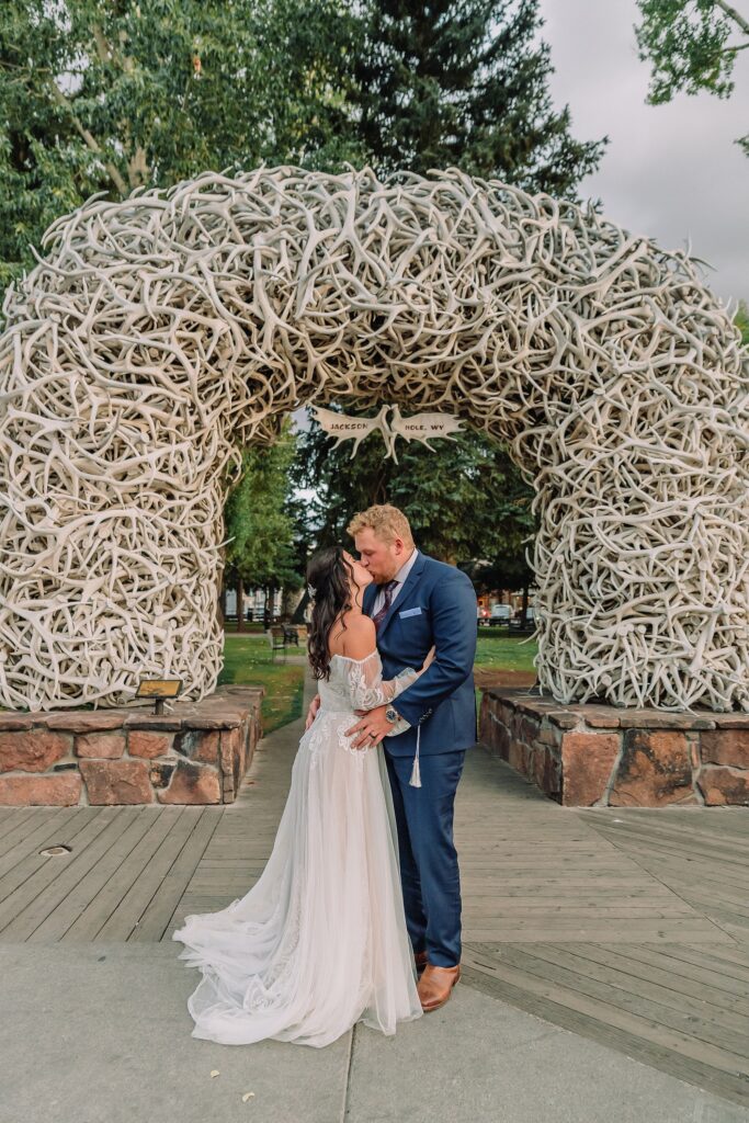 wedding couple in front of the Jackson Hole Elk Antler Arches