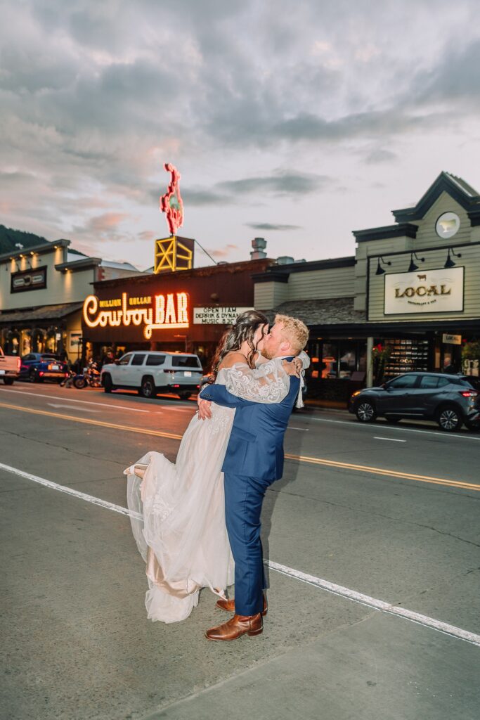 wedding couple in front of the Million Dollar Cowboy Bar in Jackson Hole