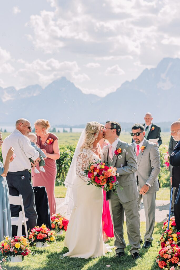 Jackson Hole luxury mountain wedding reception Jackson Hole destination wedding photographer sunset wedding portraits in the Tetons intimate Jackson Lake Lodge wedding celebration summer wedding in grand teton national park