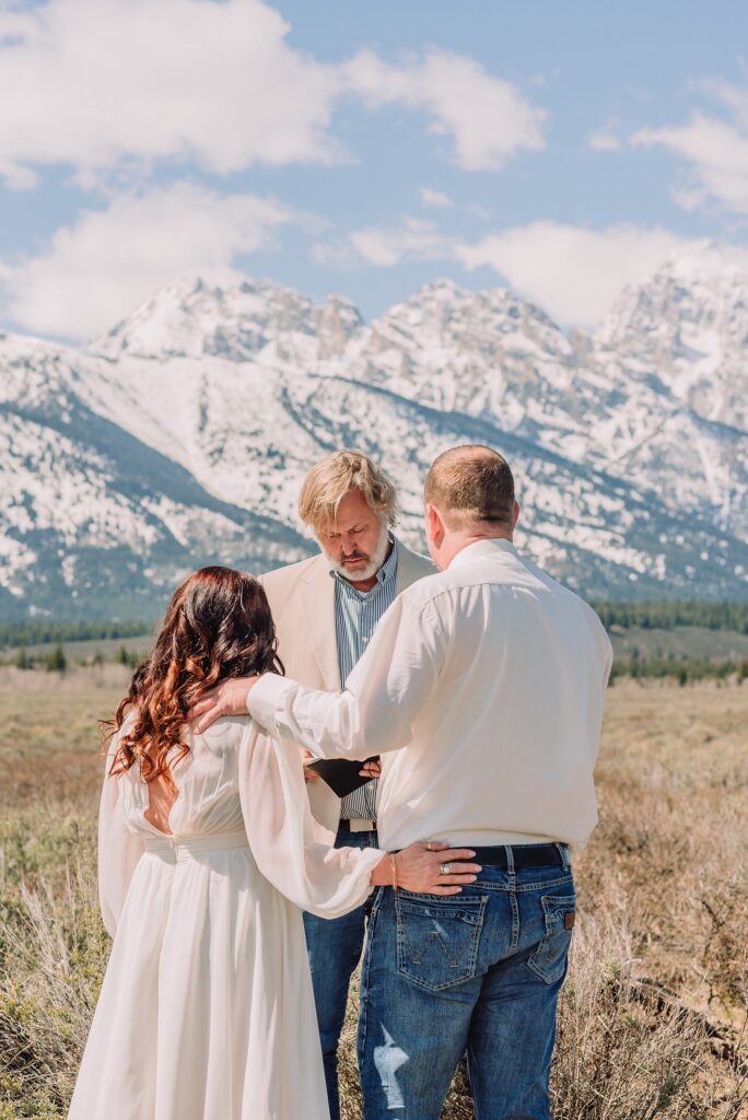 Grand Teton elopement at Albright View Turnout Pastor Ray officiant Grand Teton wedding ceremony Early May Grand Teton elopement photography Intimate mountain wedding with family witnesses