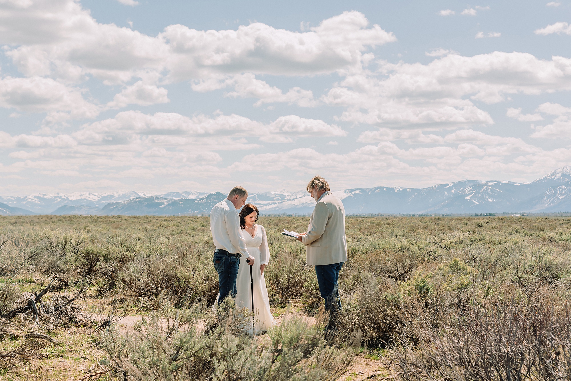 Grand Teton elopement at Albright View Turnout Pastor Ray officiant Grand Teton wedding ceremony Early May Grand Teton elopement photography Intimate mountain wedding with family witnesses