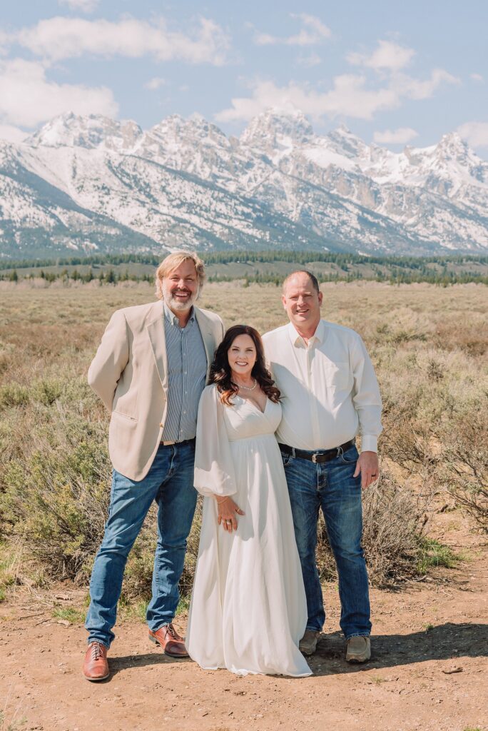 Grand Teton elopement at Albright View Turnout Pastor Ray officiant Grand Teton wedding ceremony Early May Grand Teton elopement photography Intimate mountain wedding with family witnesses
