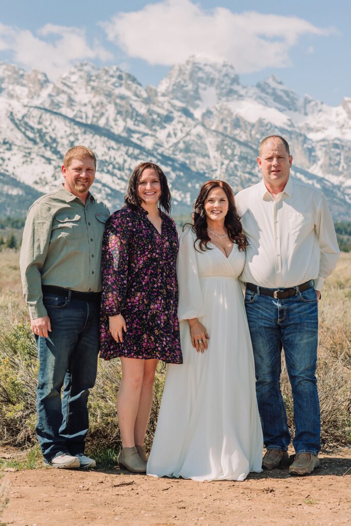 Grand Teton elopement at Albright View Turnout Pastor Ray officiant Grand Teton wedding ceremony Early May Grand Teton elopement photography Intimate mountain wedding with family witnesses