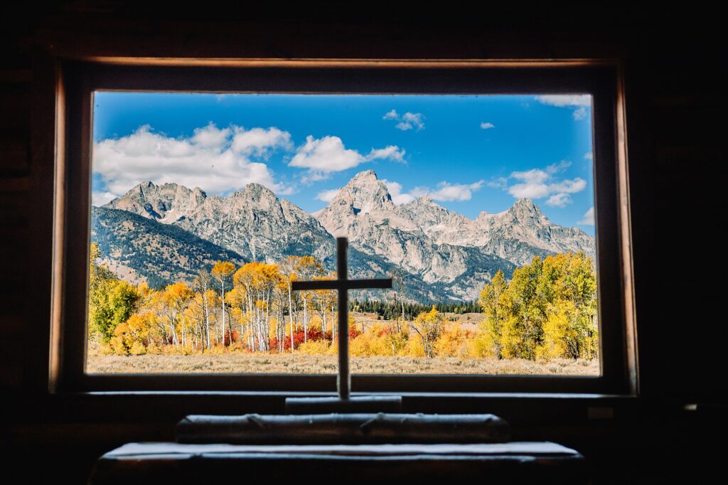 historic chapel wedding Wyoming mountains intimate wedding Chapel of the Transfiguration family photos Chapel of the Transfiguration wedding ceremony Grand Teton bride in mother's wedding dress teal boots fall wedding Chapel of the Transfiguration September Grand Teton National Park micro wedding