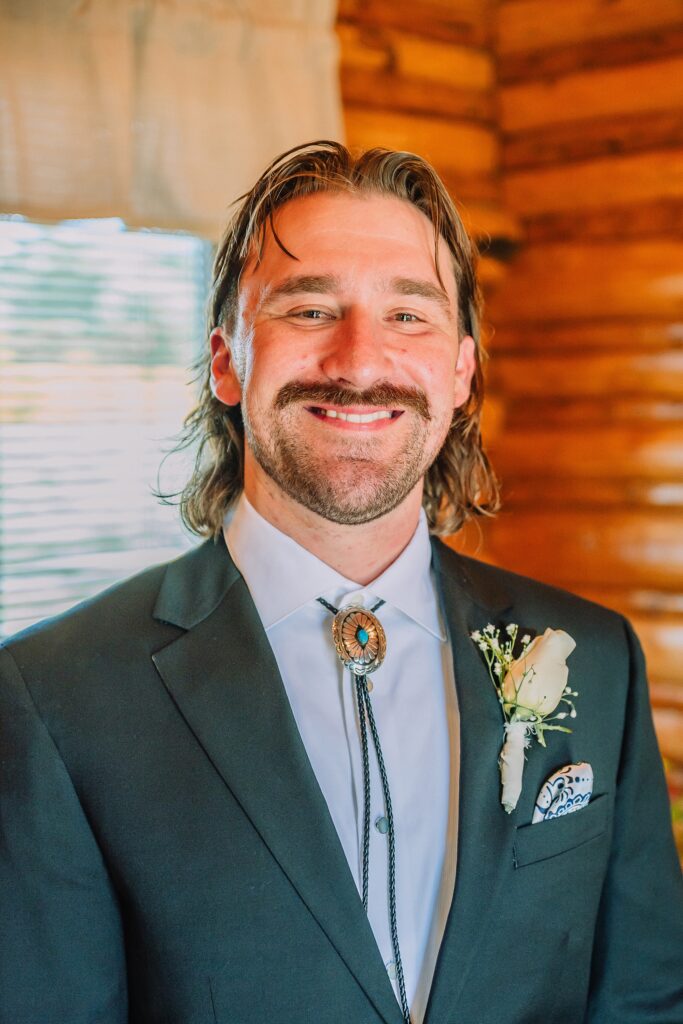 historic chapel wedding Wyoming mountains intimate wedding Chapel of the Transfiguration family photos Chapel of the Transfiguration wedding ceremony Grand Teton bride in mother's wedding dress teal boots fall wedding Chapel of the Transfiguration September Grand Teton National Park micro wedding