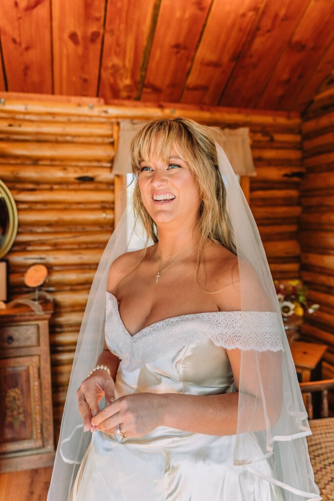 historic chapel wedding Wyoming mountains intimate wedding Chapel of the Transfiguration family photos Chapel of the Transfiguration wedding ceremony Grand Teton bride in mother's wedding dress teal boots fall wedding Chapel of the Transfiguration September Grand Teton National Park micro wedding