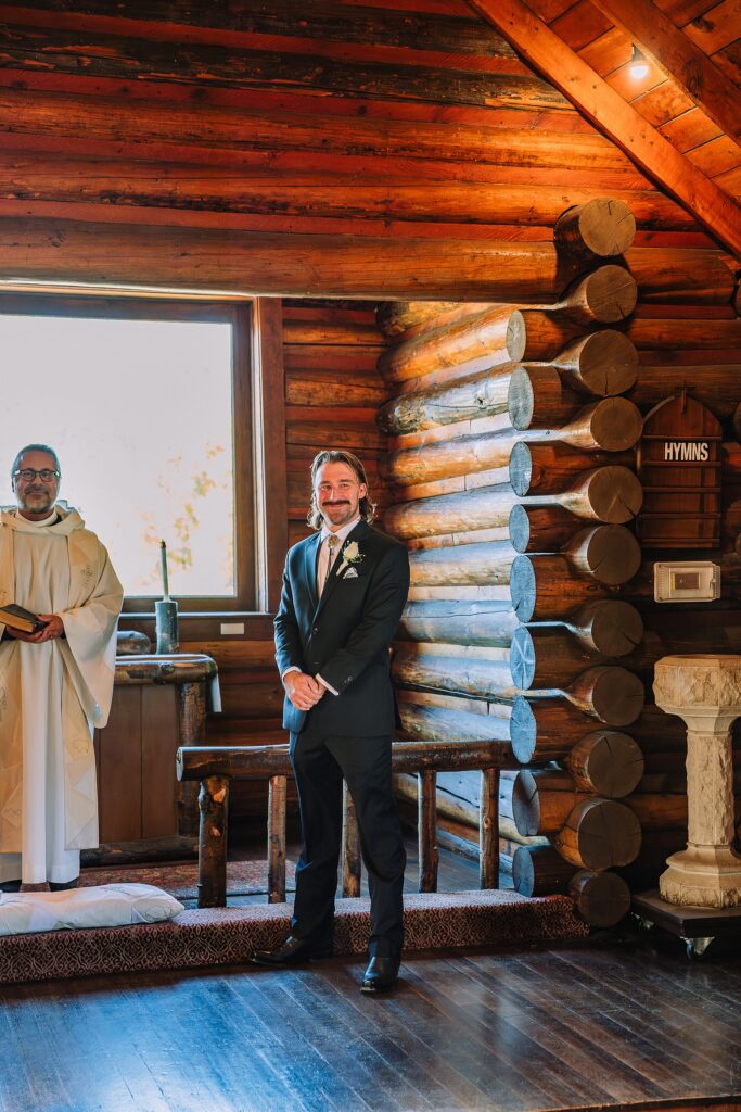 Grand Teton National Park micro wedding Chapel of the Transfiguration bride and groom portraits bride groom cowboy hat bolo tie mountain wedding Chapel of the Transfiguration bell ringing celebration Jackson Hole Wedding Photographers rustic chapel wedding log cabin ceremony