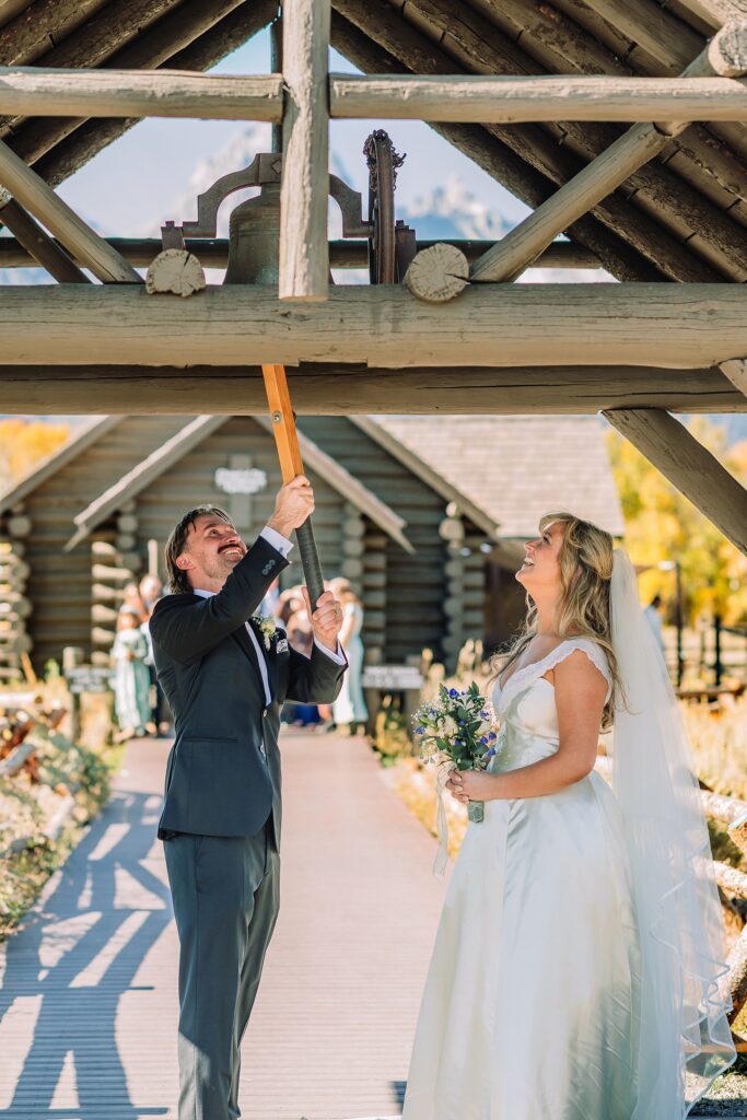 historic chapel wedding Wyoming mountains intimate wedding Chapel of the Transfiguration family photos Chapel of the Transfiguration wedding ceremony Grand Teton bride in mother's wedding dress teal boots fall wedding Chapel of the Transfiguration September Grand Teton National Park micro wedding Chapel of the Transfiguration bride and groom portraits