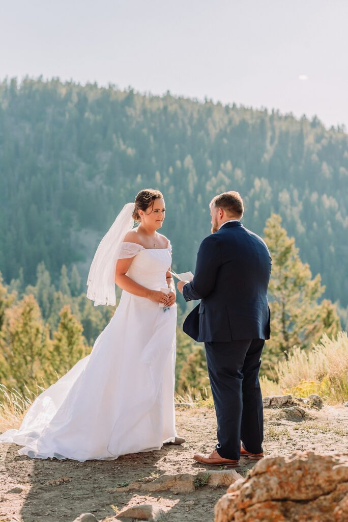 The Wedding Tree ceremony photos Wyoming bride wearing mother's wedding dress mountain elopement with Teton backdrop small intimate wedding ceremony ideas intimate outdoor Wyoming wedding inspiration