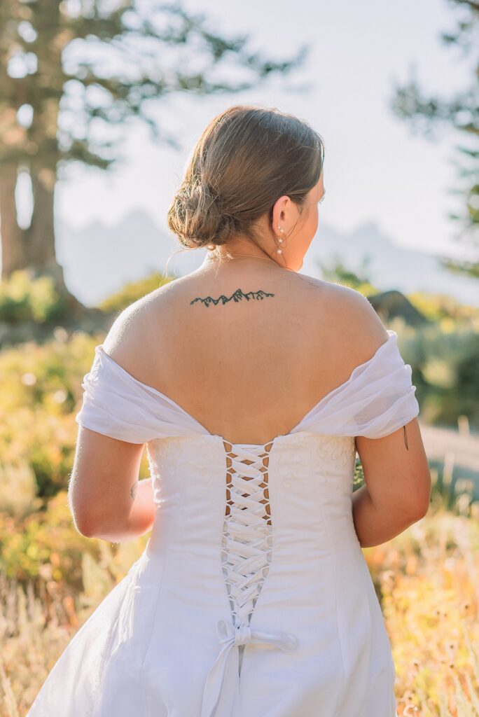 The Wedding Tree ceremony photos Wyoming bride wearing mother's wedding dress mountain elopement with Teton backdrop small intimate wedding ceremony ideas intimate outdoor Wyoming wedding inspiration