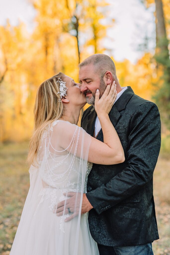 Jackson Hole honeymoon wedding photos Schwabacher Landing wedding portraits Snake River wedding photography September mountain wedding photos beaded wedding dress golden hour western groom style wedding photos Teton mountain wedding portraits sheer cape wedding dress photography