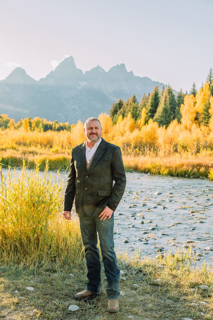 Jackson Hole honeymoon wedding photos Schwabacher Landing wedding portraits Snake River wedding photography September mountain wedding photos beaded wedding dress golden hour western groom style wedding photos Teton mountain wedding portraits sheer cape wedding dress photography