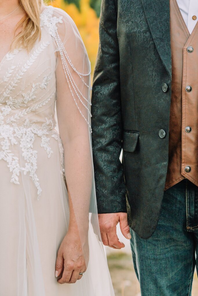 Jackson Hole honeymoon wedding photos Schwabacher Landing wedding portraits Snake River wedding photography September mountain wedding photos beaded wedding dress golden hour western groom style wedding photos Teton mountain wedding portraits sheer cape wedding dress photography