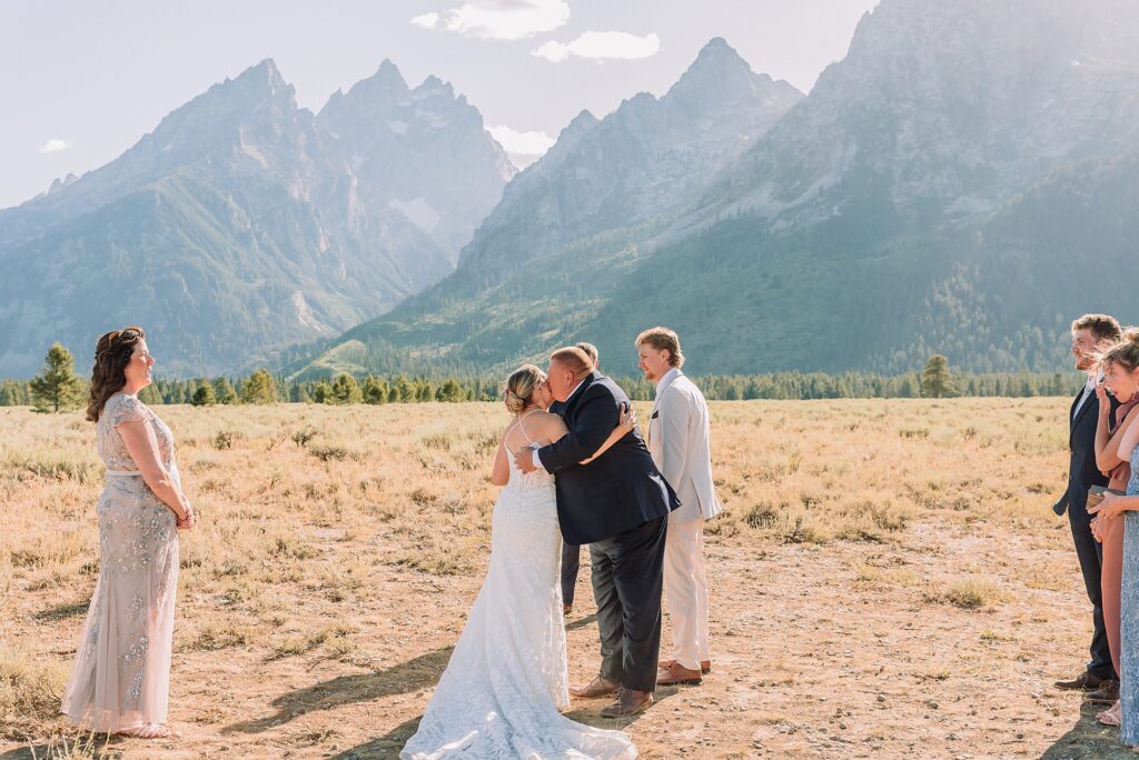 Cathedral View Turnout elopement ceremony Grand Teton National Park bride on horse Grand Teton elopement couple running down road Grand Teton elopement Jackson Hole micro wedding photographer how to get married in grand teton national park western wedding at Cathedral View Turnout horses in western wedding jackson hole