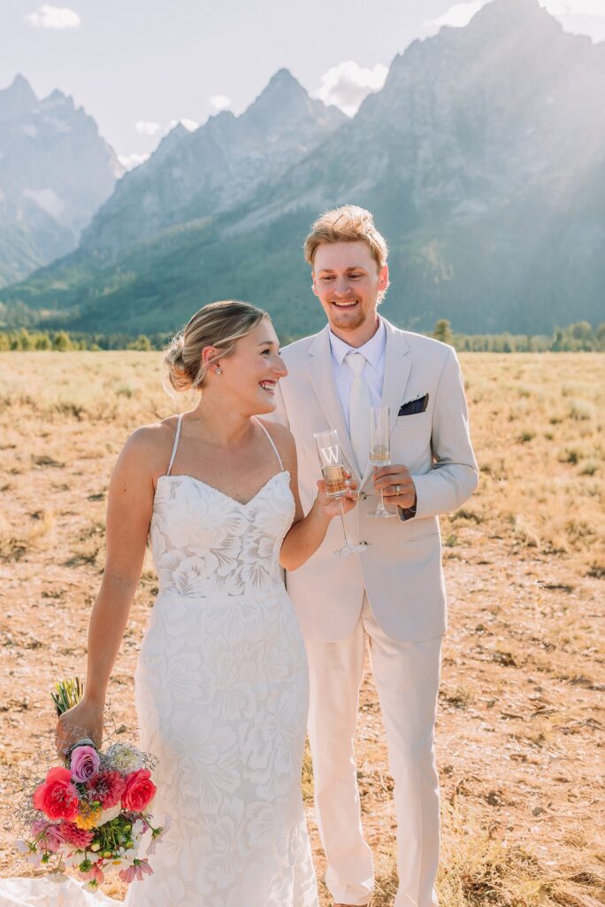 Cathedral View Turnout elopement ceremony Grand Teton National Park bride on horse Grand Teton elopement couple running down road Grand Teton elopement Jackson Hole micro wedding photographer how to get married in grand teton national park western wedding at Cathedral View Turnout horses in western wedding jackson hole