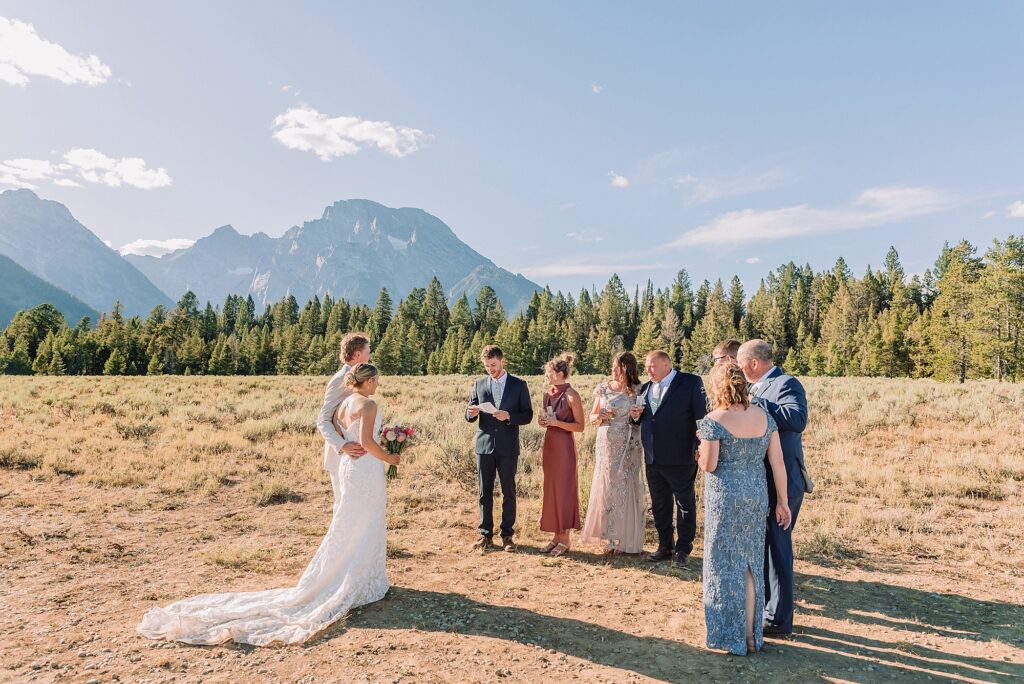 Cathedral View Turnout elopement ceremony Grand Teton National Park bride on horse Grand Teton elopement couple running down road Grand Teton elopement Jackson Hole micro wedding photographer how to get married in grand teton national park western wedding at Cathedral View Turnout horses in western wedding jackson hole