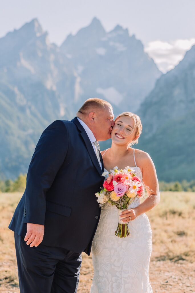 Cathedral View Turnout elopement ceremony Grand Teton National Park bride on horse Grand Teton elopement couple running down road Grand Teton elopement Jackson Hole micro wedding photographer how to get married in grand teton national park western wedding at Cathedral View Turnout horses in western wedding jackson hole