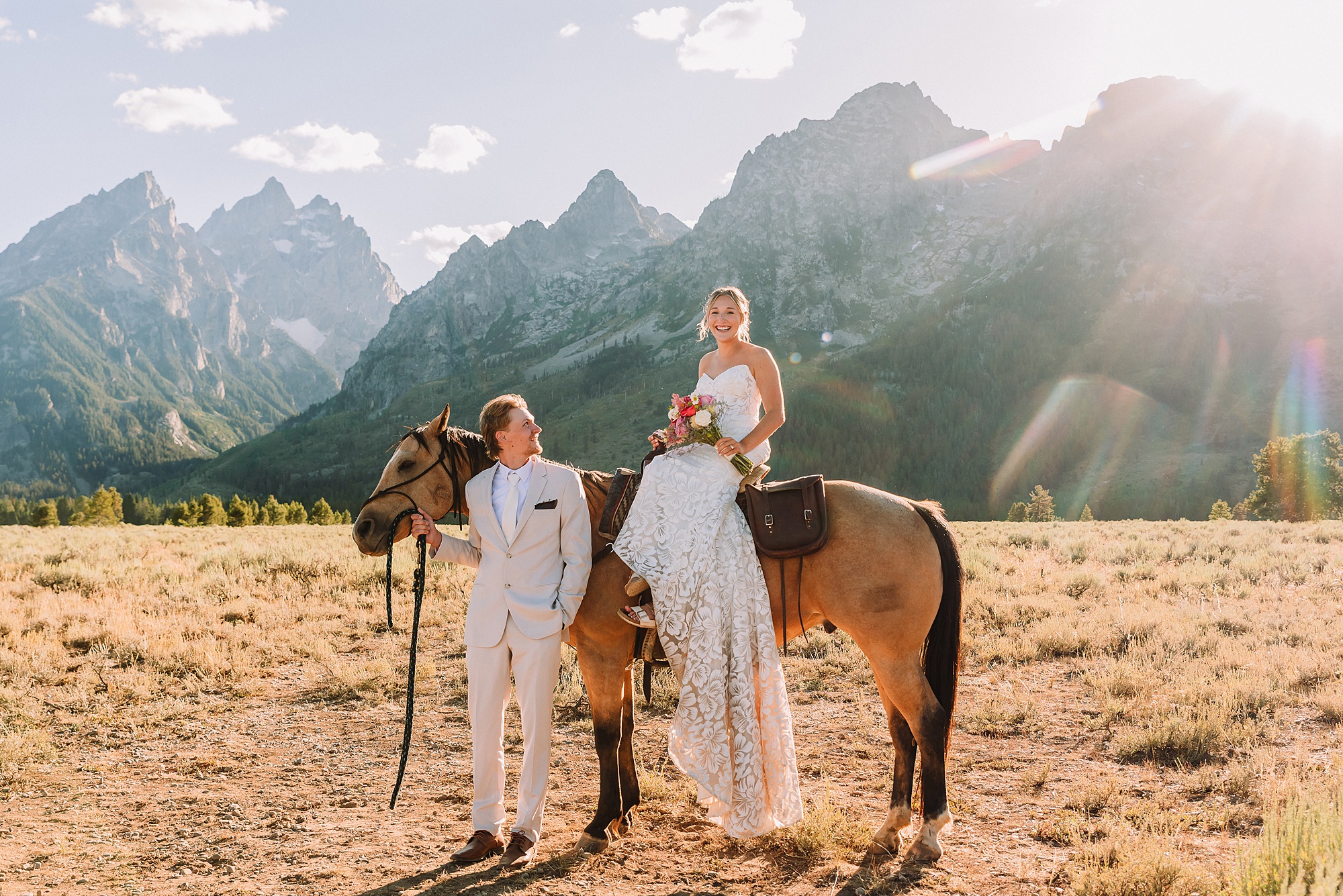 Cathedral View Turnout elopement ceremony Grand Teton National Park bride on horse Grand Teton elopement couple running down road Grand Teton elopement Jackson Hole micro wedding photographer how to get married in grand teton national park western wedding at Cathedral View Turnout horses in western wedding jackson hole