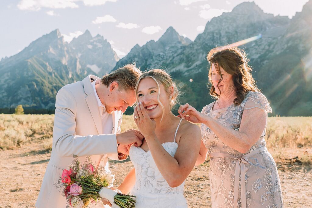 Cathedral View Turnout elopement ceremony Grand Teton National Park bride on horse Grand Teton elopement couple running down road Grand Teton elopement Jackson Hole micro wedding photographer how to get married in grand teton national park western wedding at Cathedral View Turnout horses in western wedding jackson hole