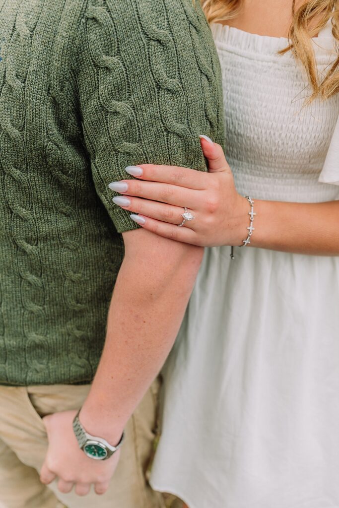 Grand Teton proposal photos at Cathedral View Turnout in the rain Cathedral View Turnout proposal photographer Jackson Hole Wyoming Genuine proposal reaction photos Grand Teton sagebrush field Moody stormy mountain proposal photography Jackson Hole jackson hole proposal photographer