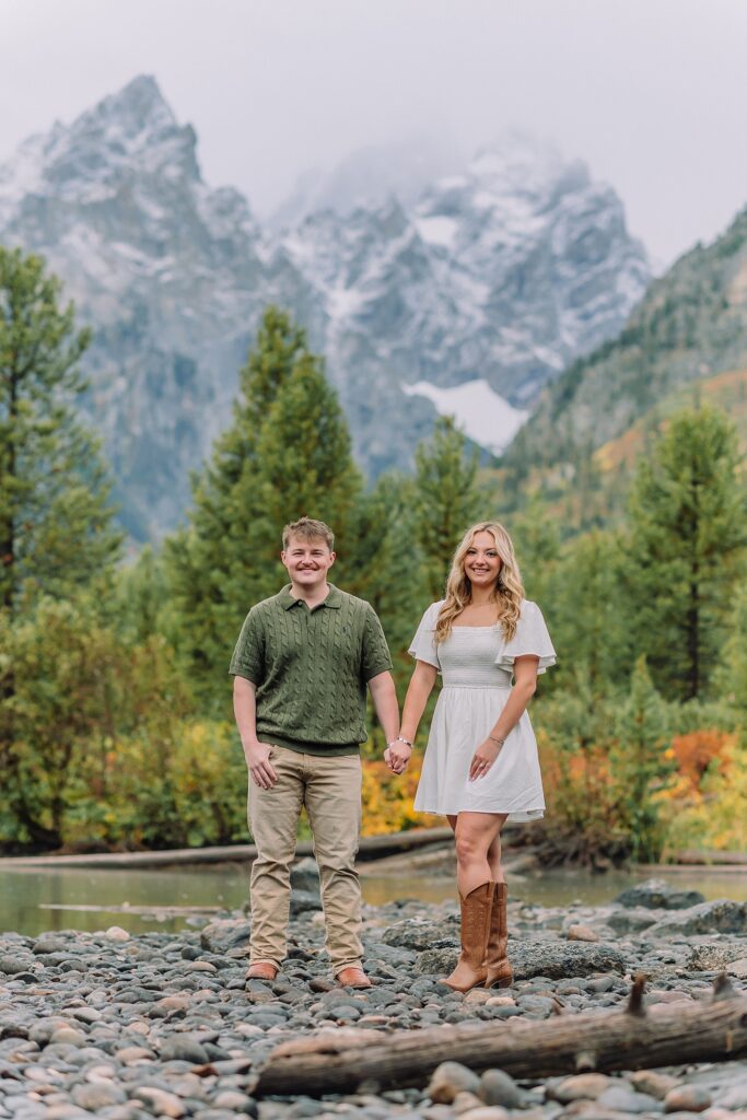 String Lake fall engagement photos Grand Teton National Park Rainy day engagement photos Grand Teton National Park fall Fall colors engagement session String Lake Wyoming mountains Couple getting engaged with Teton mountain peaks in background jackson hole engagement photographer