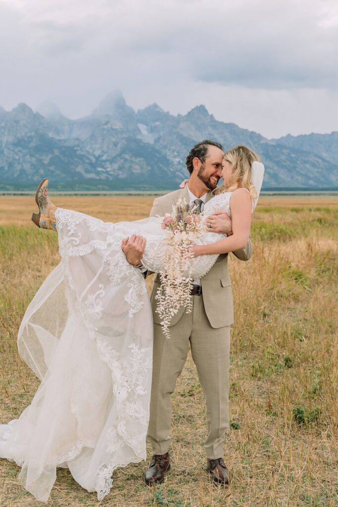 Mormon Row Grand Teton wedding ceremony cathedral veil alpine wedding photography fall colors Grand Teton elopement intimate outdoor micro wedding Wyoming champagne toast Grand Teton wedding celebration semi-formal outdoor alpine wedding attire first look Mormon Row Grand Tetons