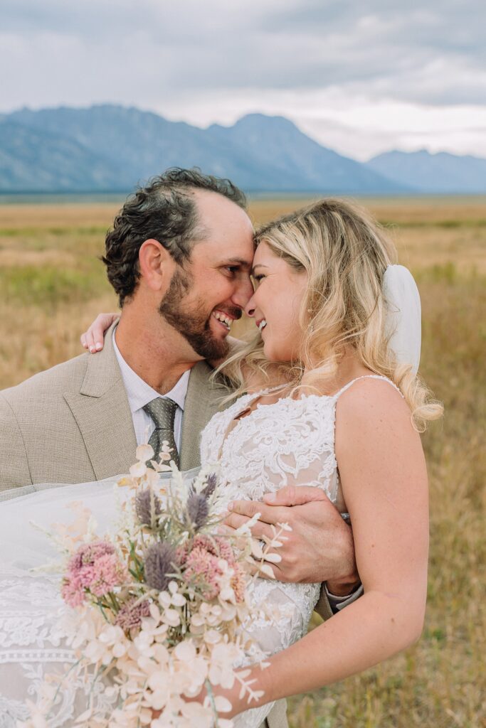 Mormon Row Grand Teton wedding ceremony cathedral veil alpine wedding photography fall colors Grand Teton elopement intimate outdoor micro wedding Wyoming champagne toast Grand Teton wedding celebration semi-formal outdoor alpine wedding attire first look Mormon Row Grand Tetons