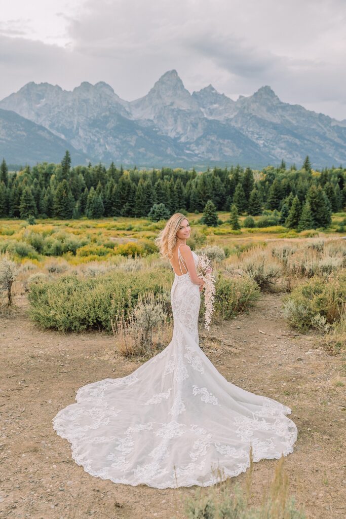 Jackson Hole micro wedding photographer Blacktail Ponds Overlook wedding portraits Wyoming Grand Teton wedding with moose wildlife September Grand Teton wedding fall colors dramatic cathedral veil sagebrush Teton backdrop