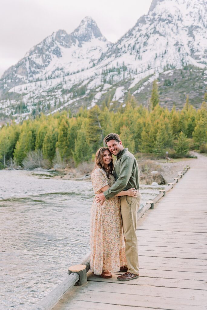 String Lake maternity photos with mountain backdrop String Lake pregnancy photos with water reflection Pregnant couple photos in Jackson Hole Wyoming May maternity photo session Grand Teton National Park Jackson Hole Family Photographer