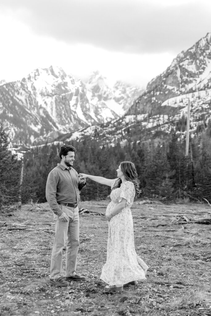 String Lake maternity photos with mountain backdrop String Lake pregnancy photos with water reflection Pregnant couple photos in Jackson Hole Wyoming May maternity photo session Grand Teton National Park Jackson Hole Family Photographer