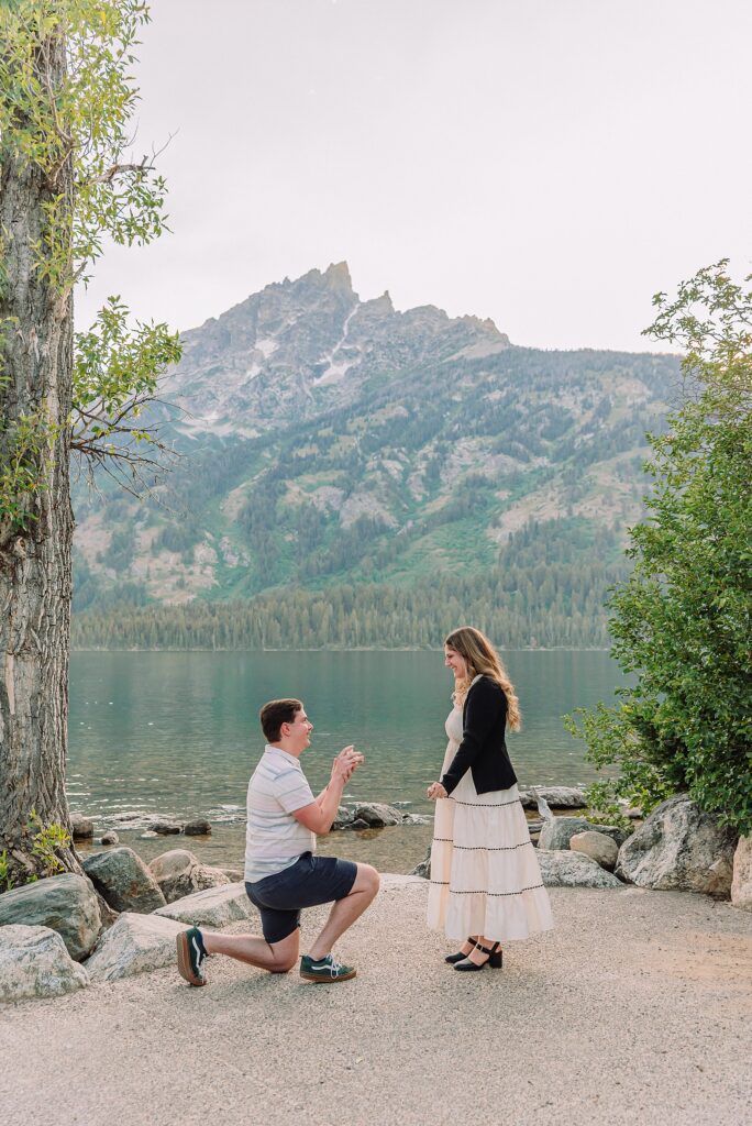 Jackson Hole Engagement Photographer grand teton national park proposal photography lakeside engagement portraits Jackson Hole surprise proposal photographer Grand Tetons Jenny Lake couple photos summer romantic Jackson Hole engagement session