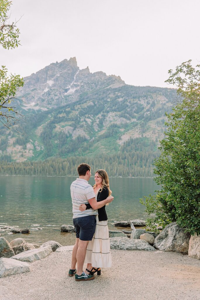 Jackson Hole Engagement Photographer grand teton national park proposal photography lakeside engagement portraits Jackson Hole surprise proposal photographer Grand Tetons Jenny Lake couple photos summer romantic Jackson Hole engagement session