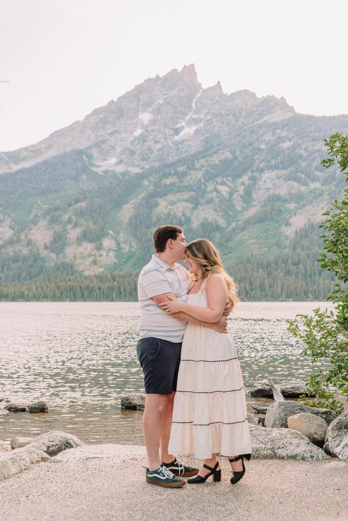 Jackson Hole engagement photos at Jenny Lake Grand Teton proposal photographer Jenny Lake Lodge engagement session mountain proposal photography Wyoming lakeside couple photos grand teton national park