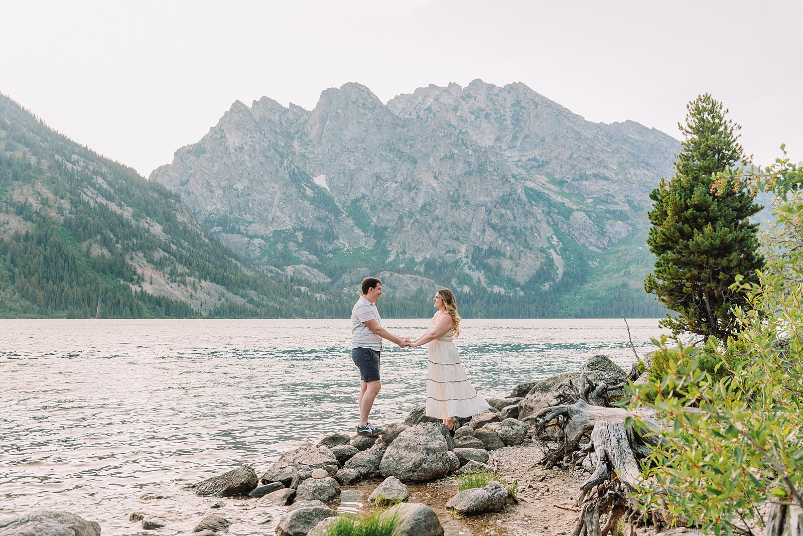 Jackson Hole engagement photos at Jenny Lake Grand Teton proposal photographer Jenny Lake Lodge engagement session mountain proposal photography Wyoming lakeside couple photos grand teton national park