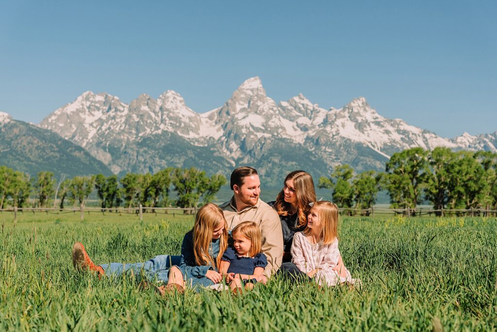 Jackson Hole Family Photos family photos at Mormon Row Wyoming Teton Range family portraits with historic barn Mormon Row south barn family pictures rustic barn backdrop family portraits Wyoming