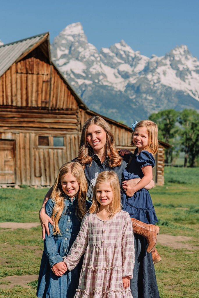 Jackson Hole Family Photos family photos at Mormon Row Wyoming Teton Range family portraits with historic barn Mormon Row south barn family pictures rustic barn backdrop family portraits Wyoming