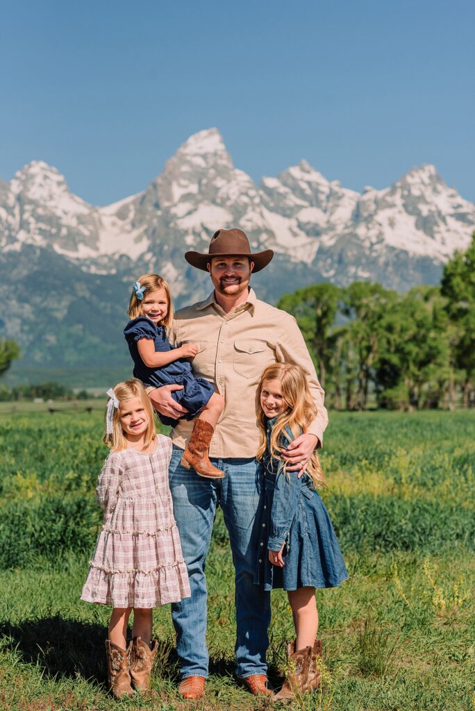 Jackson Hole Family Photos family photos at Mormon Row Wyoming Teton Range family portraits with historic barn Mormon Row south barn family pictures rustic barn backdrop family portraits Wyoming