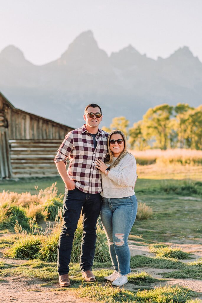 Mormon Row barn proposal photography Jackson Hole Wyoming Sunset engagement photos at TA Moulton Barn Surprise proposal photographer Grand Teton National Park Golden hour mountain proposal photography Jackson Hole Authentic couple portraits Mormon Row historic barn