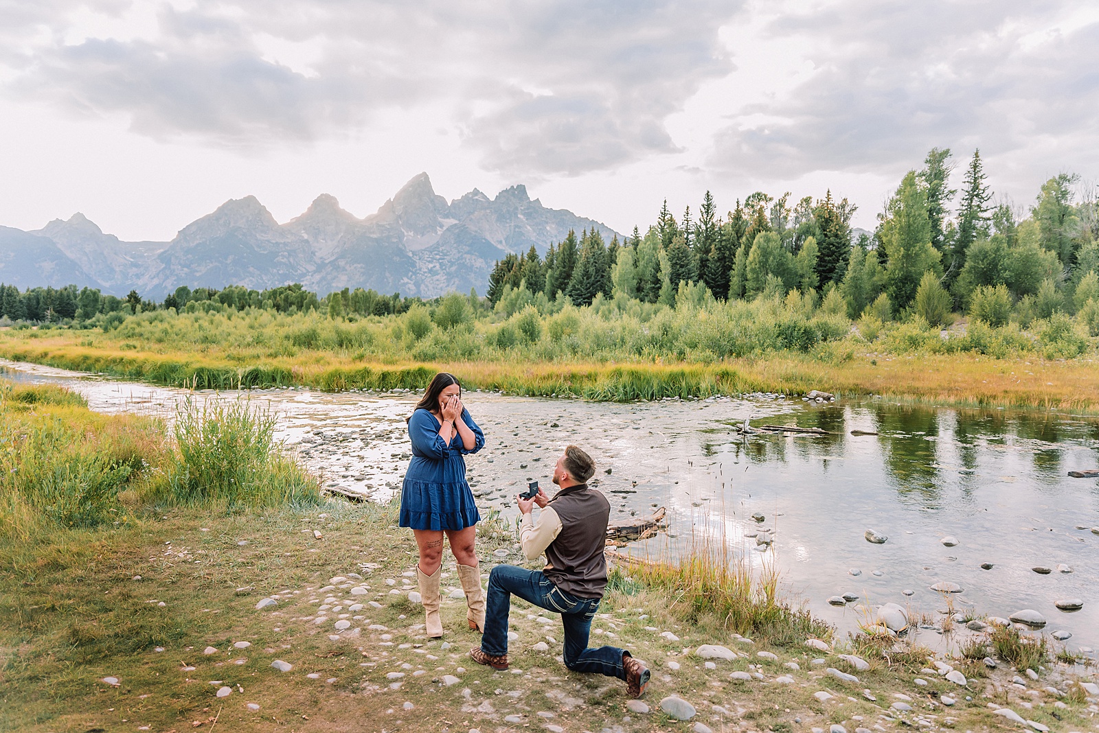 Jackson Hole engagement photos along Snake River surprise proposal reaction photography Wyoming Schwabacher Landing proposal photos romantic Jackson Hole couple photography