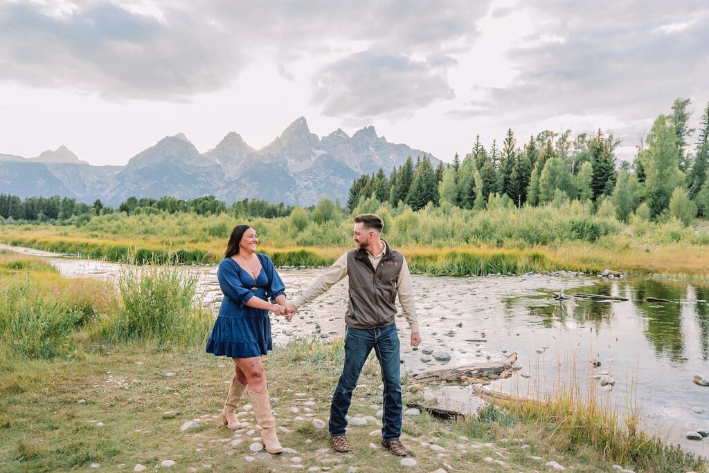Jackson Hole surprise proposal at Schwabacher Landing Grand Teton surprise proposal photographer Jackson Hole engagement photos along Snake River surprise proposal reaction photography Wyoming Schwabacher Landing proposal photos romantic Jackson Hole couple photography Grand Teton National Park proposal ideas Wyoming mountain surprise engagement session