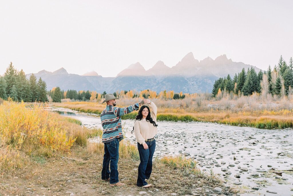 couple wearing custom engraved western hats at Grand Teton elopement turquoise wedding jewelry details at Jackson Hole mountain wedding horseback riding wedding party tour at Spring Creek Ranch Wyoming Schwabacher Landing sunset elopement portraits in Grand Teton National Park casual outfit change for relaxed mountain elopement photos split day wedding coverage for destination elopement couples flexible elopement timeline for Jackson Hole micro wedding western jeans and sweater look for Wyoming vacation style portraits