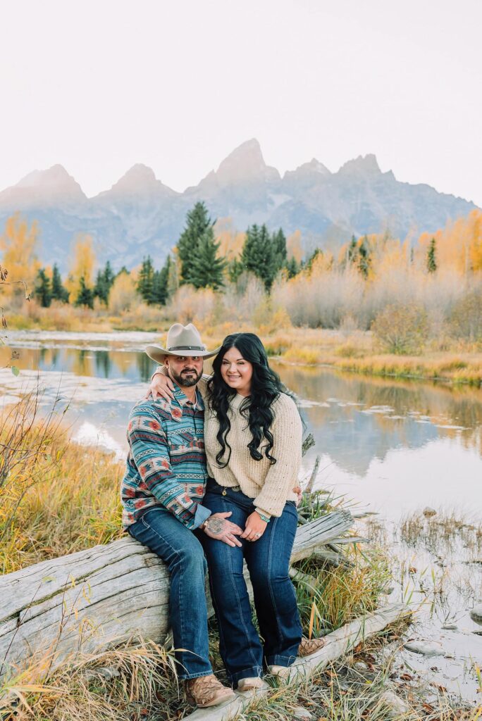 couple wearing custom engraved western hats at Grand Teton elopement turquoise wedding jewelry details at Jackson Hole mountain wedding horseback riding wedding party tour at Spring Creek Ranch Wyoming Schwabacher Landing sunset elopement portraits in Grand Teton National Park casual outfit change for relaxed mountain elopement photos split day wedding coverage for destination elopement couples flexible elopement timeline for Jackson Hole micro wedding western jeans and sweater look for Wyoming vacation style portraits