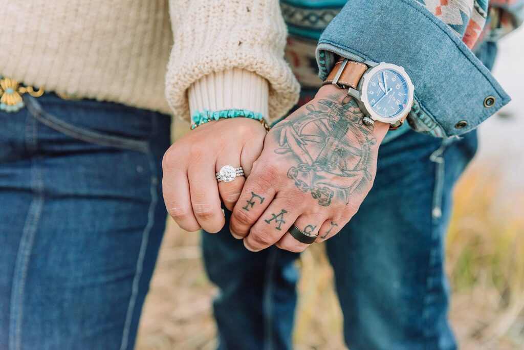 couple wearing custom engraved western hats at Grand Teton elopement turquoise wedding jewelry details at Jackson Hole mountain wedding horseback riding wedding party tour at Spring Creek Ranch Wyoming Schwabacher Landing sunset elopement portraits in Grand Teton National Park casual outfit change for relaxed mountain elopement photos split day wedding coverage for destination elopement couples flexible elopement timeline for Jackson Hole micro wedding western jeans and sweater look for Wyoming vacation style portraits