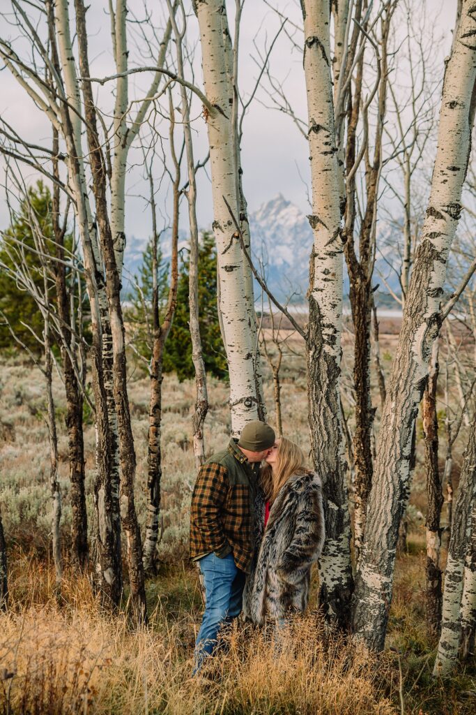 willow flats anniversary session with teton mountain views fall anniversary photos with aspen trees jackson hole jackson hole anniversary photographer capturing love stories luxury anniversary photography willow flats jackson lake views