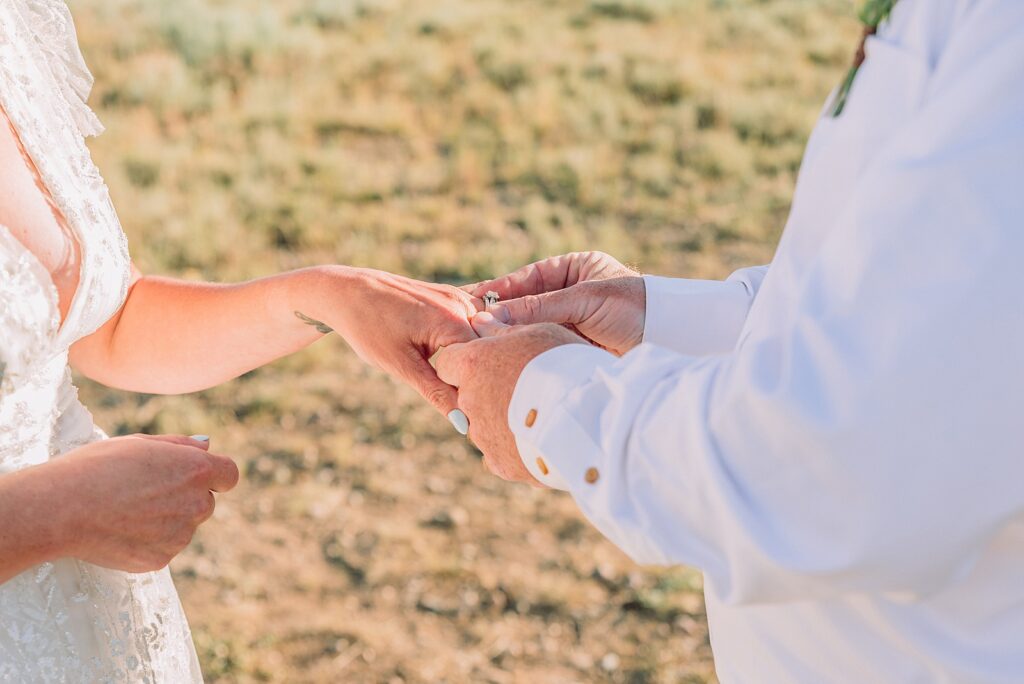 Jackson Hole vow renewal at Cathedral View Turnout intimate mountain vow renewal ceremony Wyoming 10 year anniversary vow renewal Grand Tetons beaded wedding dress mountain vow renewal Cathedral View Turnout vow renewal photographer Grand Teton National Park intimate wedding ceremony